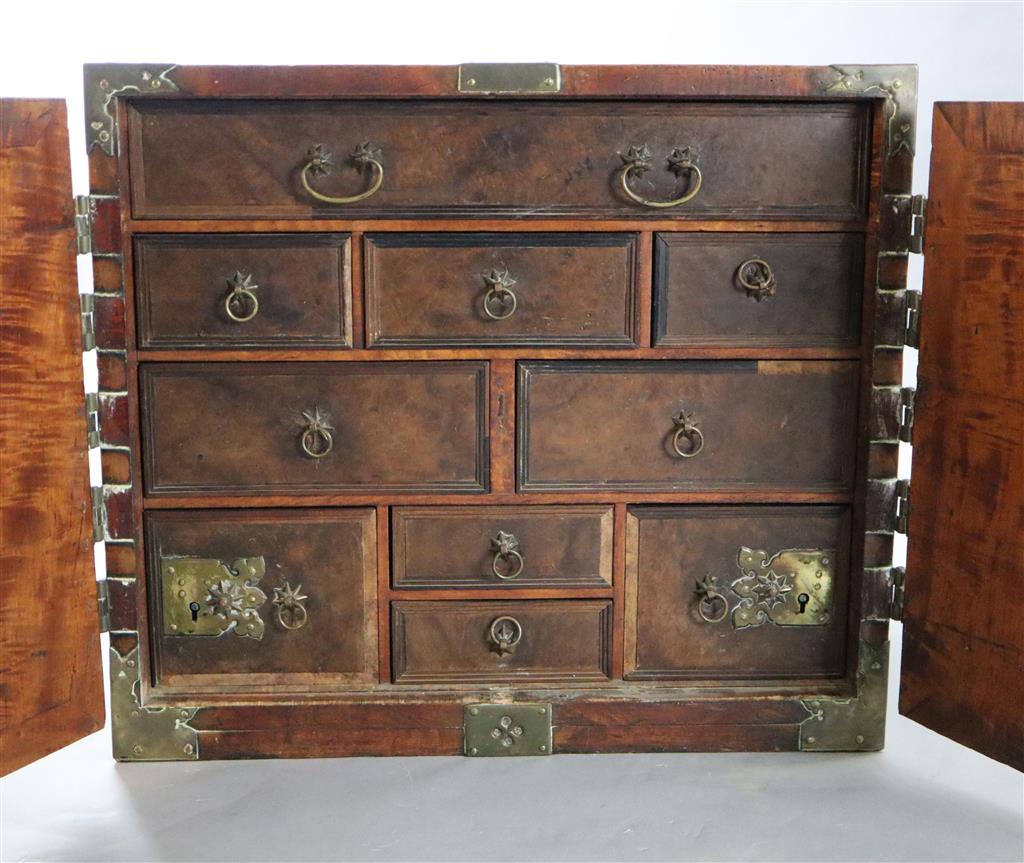 An Indo-Dutch satinwood and brass mounted cabinet, Batavia 1650-1680, Width 2ft 4in, depth 1ft 7in, height 2ft.